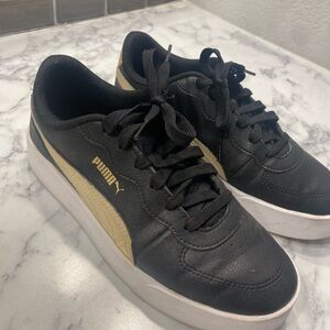 Puma Black and Gold Sneakers